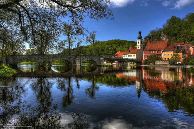 Village on Riverbank — Blue, Serene, Afternoon, Photograph, Bridge