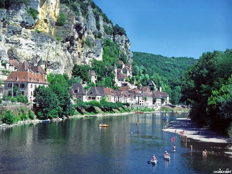 Village on Riverbank — Blue, Serene, Afternoon, Photograph, River, Cliff