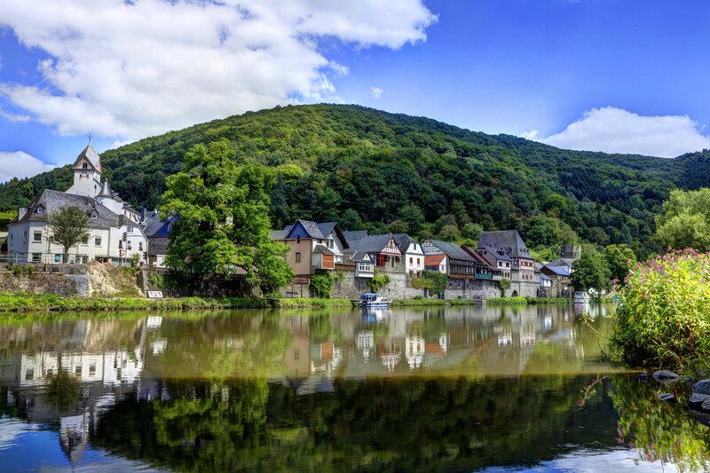 Village on Riverbank — Green, Serene, Afternoon, Photograph