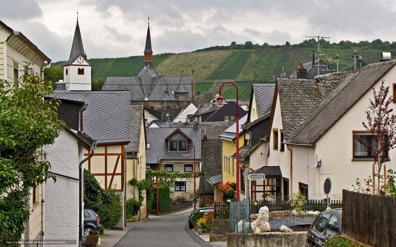 Village street with church and vineyards