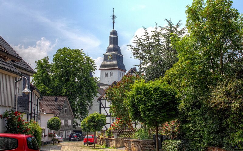 Village street with church tower