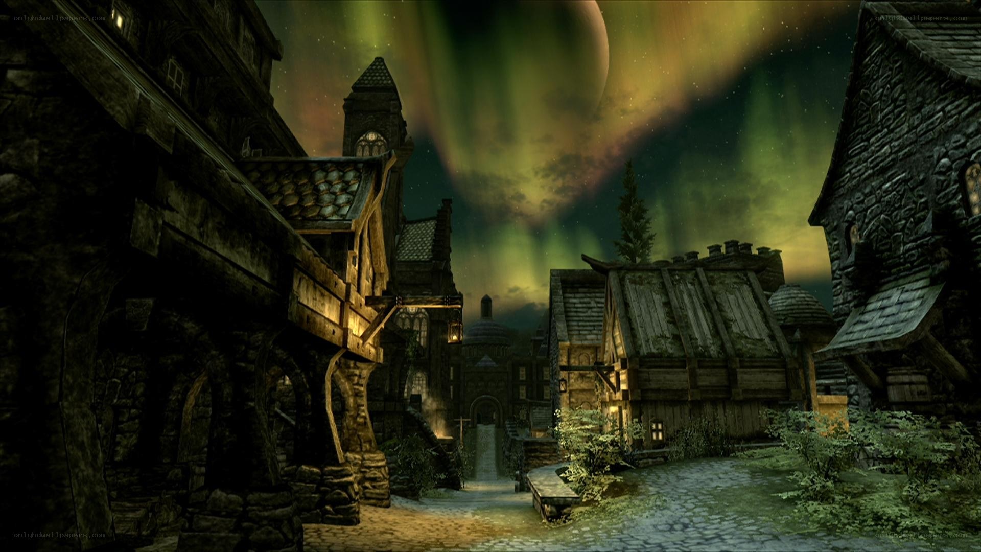 village under aurora borealis
