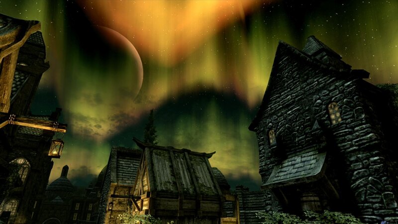 village under aurora borealis