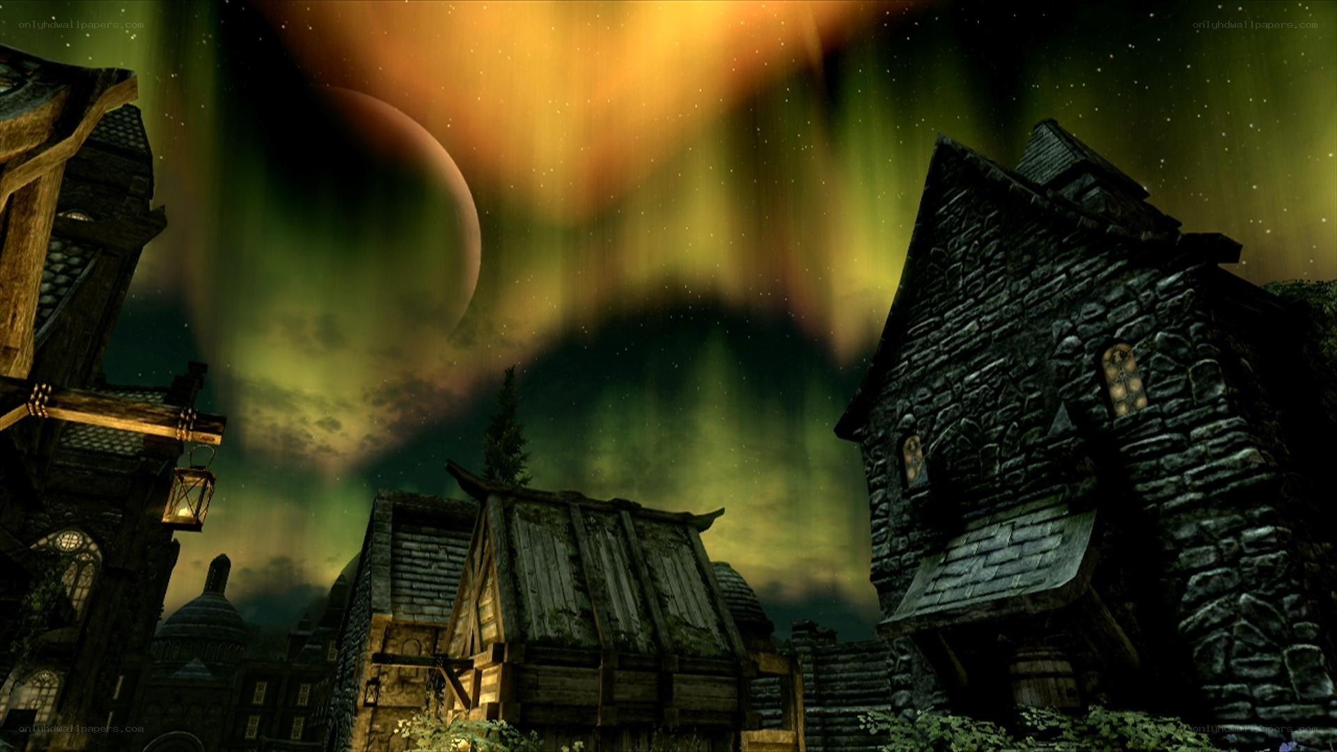 village under aurora borealis
