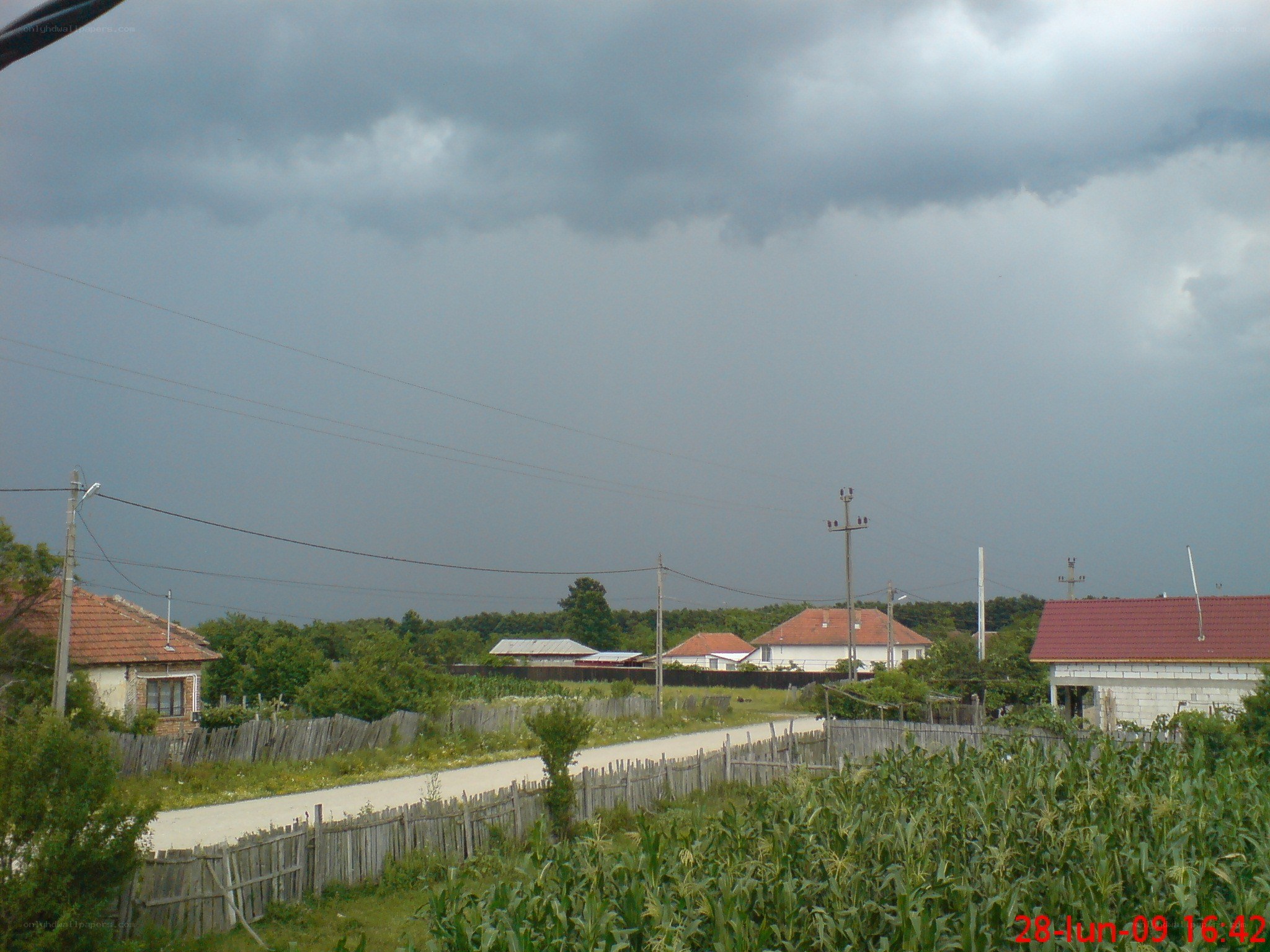 village under stormy sky