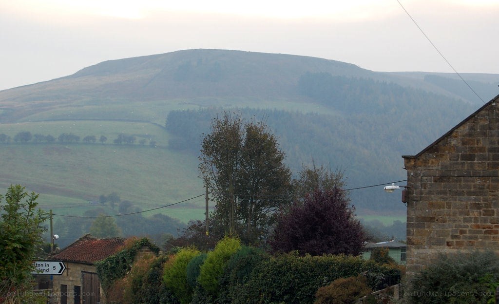 village with hill in background