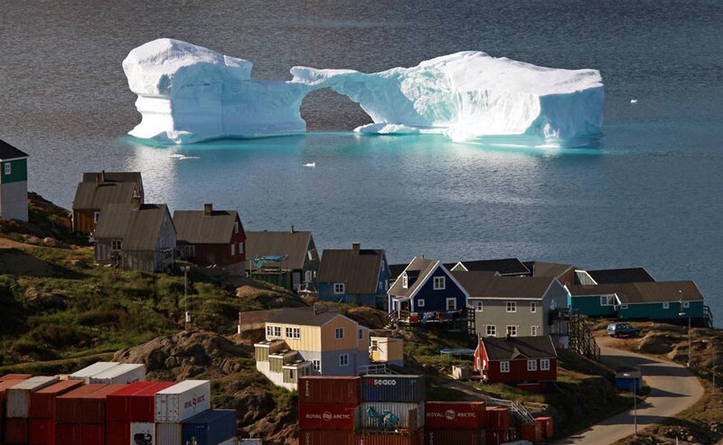 Village with iceberg in harbor