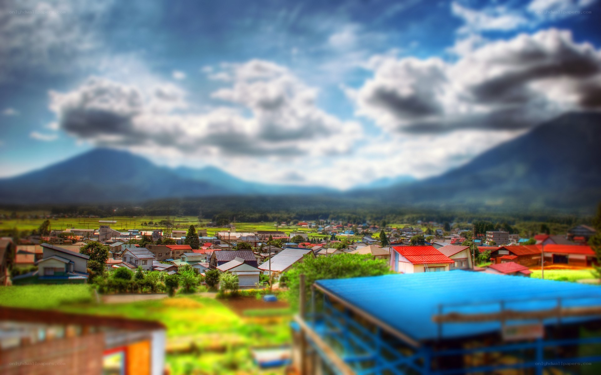 village with mountains in background