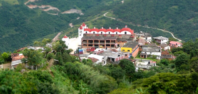 village with red-roofed church