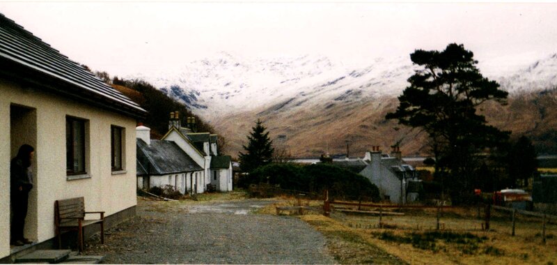 village with snow-capped mountains