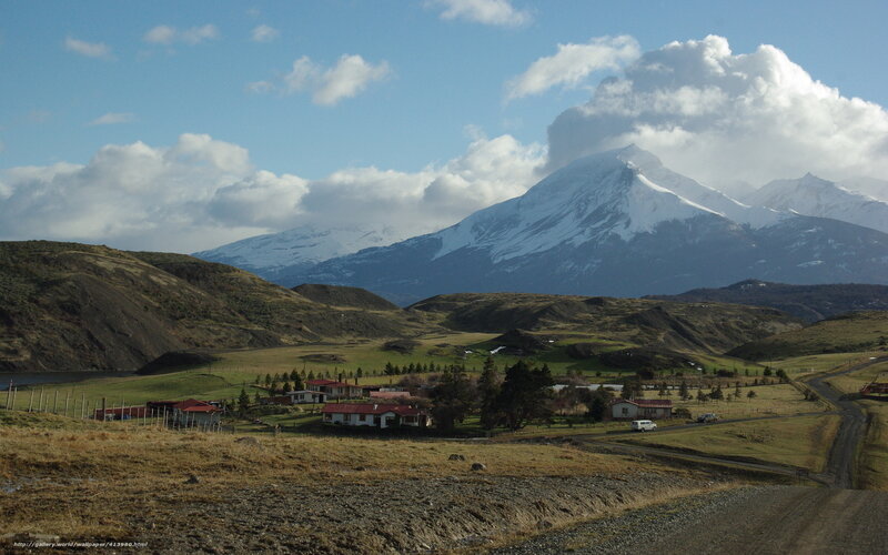 Village with snow-capped mountains