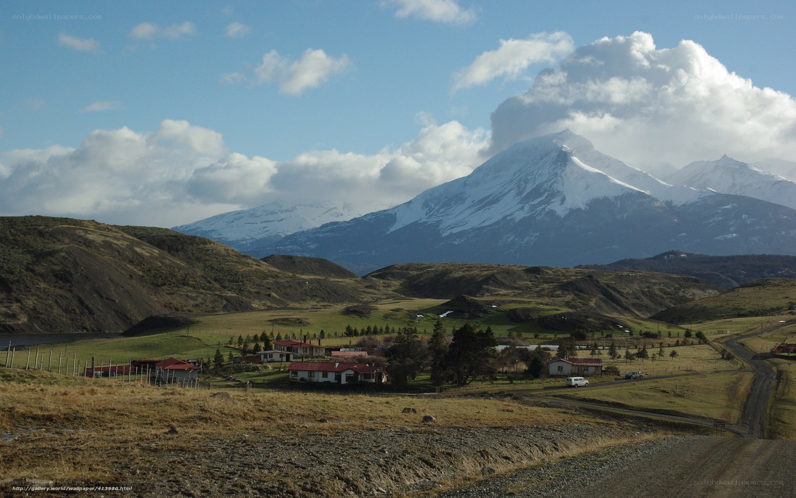 Village with snow-capped mountains