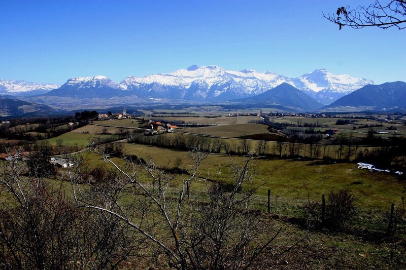 Village with snow-capped mountains
