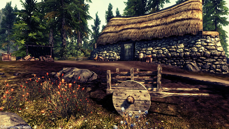 village with thatched cottage