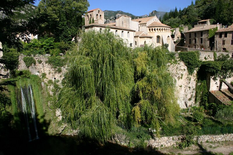 Village with waterfall and church