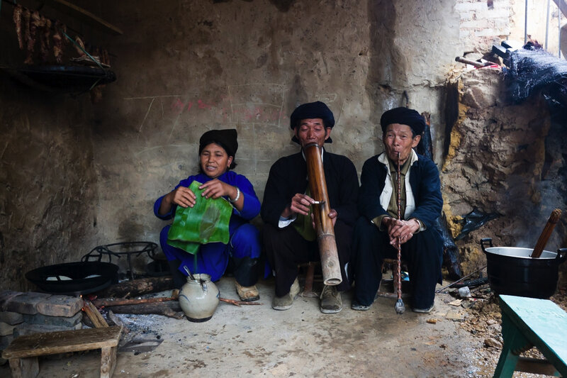 Villagers in a rustic home