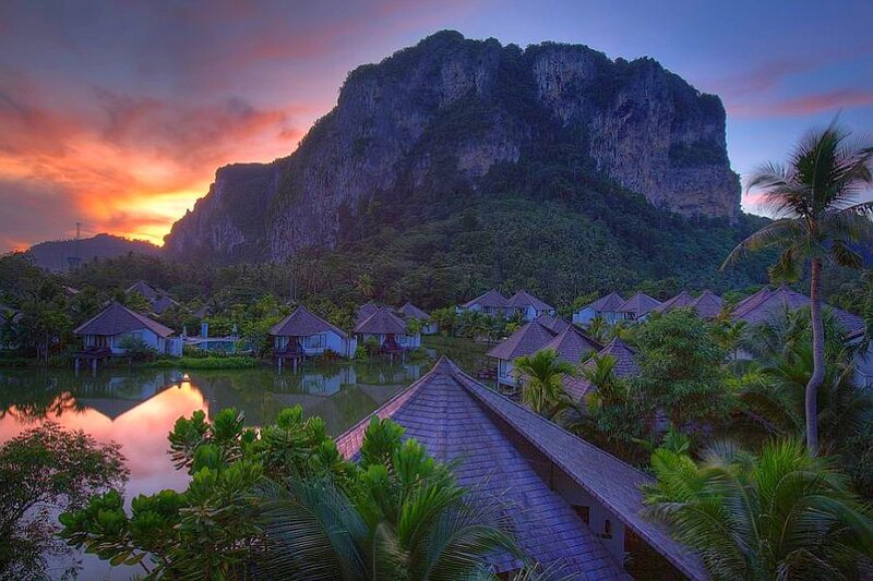 Villas by a mountain at sunset