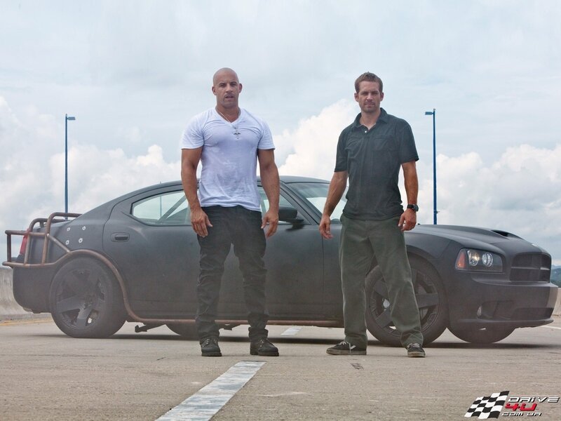 Vin Diesel and Paul Walker with car