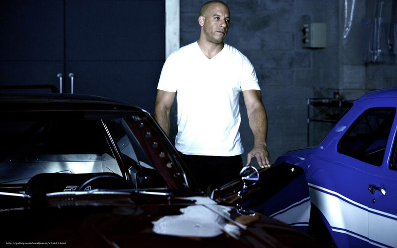 Vin Diesel in garage with cars
