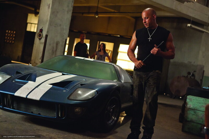 Vin Diesel with a car in a garage