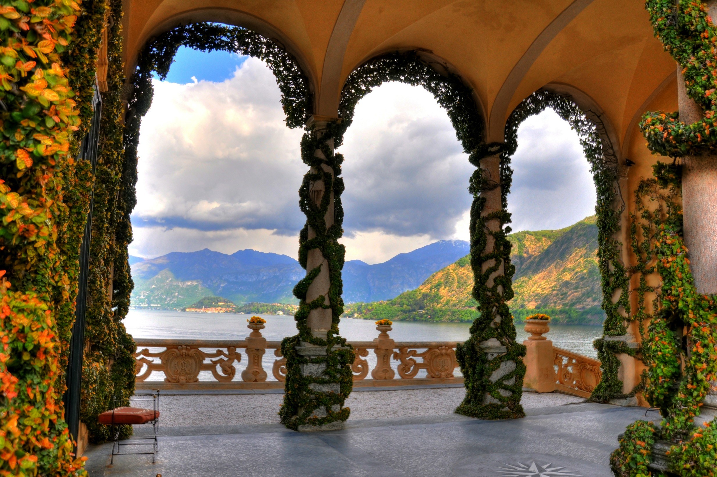 Vine-covered arches overlooking a lake