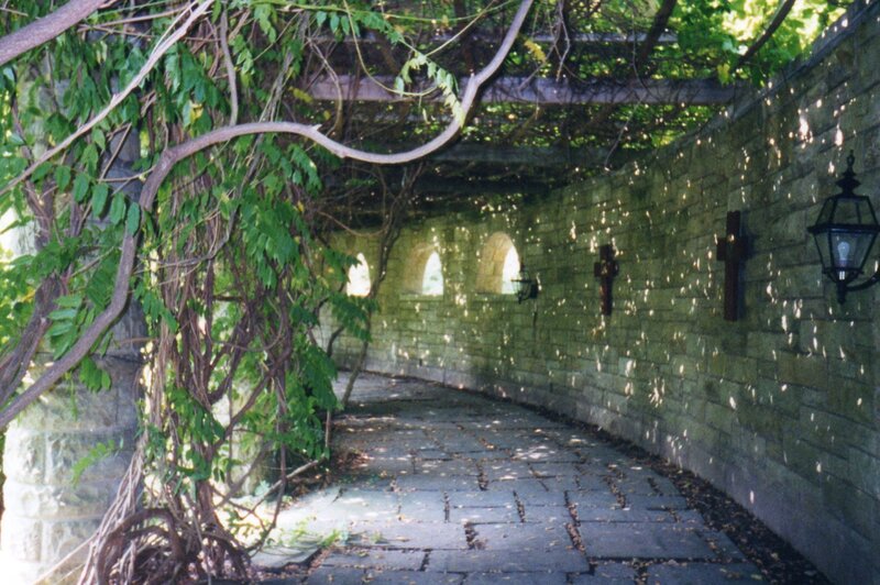 Vine-covered stone walkway