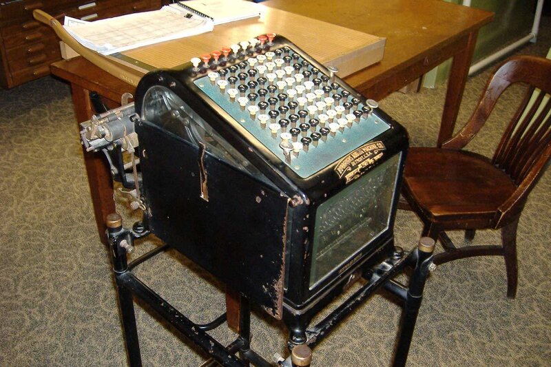 vintage adding machine on desk