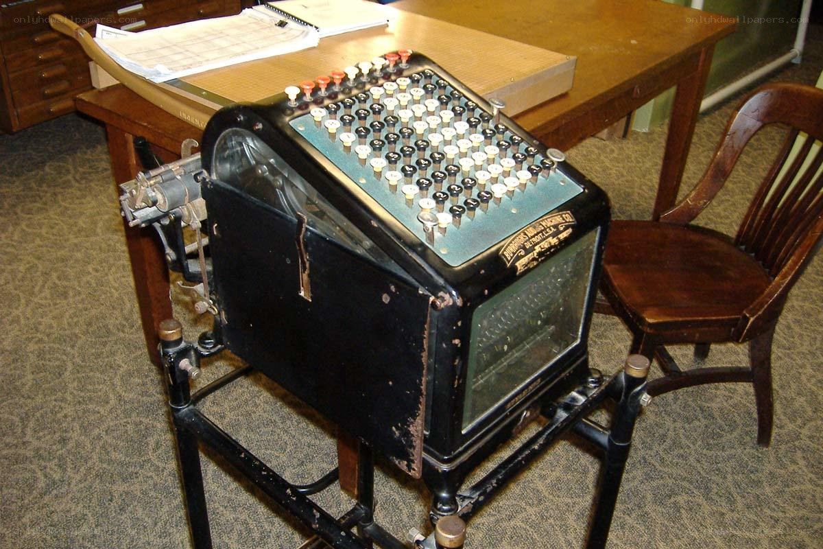 vintage adding machine on desk
