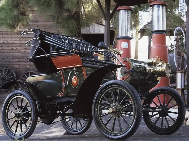 Vintage automobile at a gas station