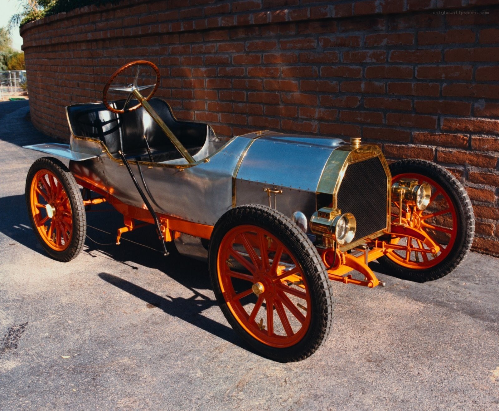 vintage automobile by brick wall