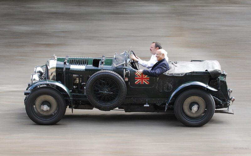 Vintage Bentley race car in motion