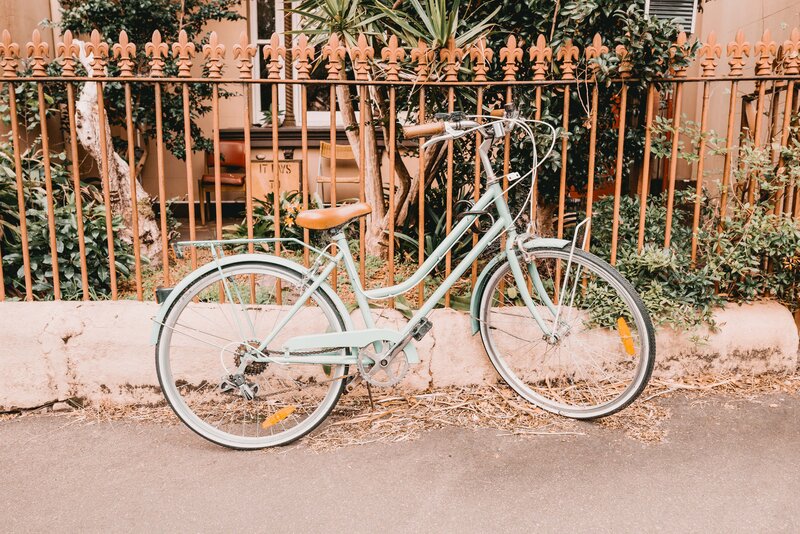 Vintage bicycle by fence