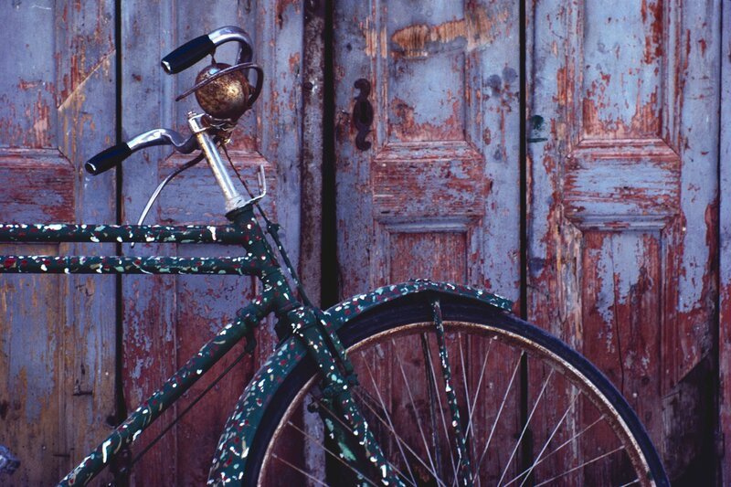 vintage bike against weathered door