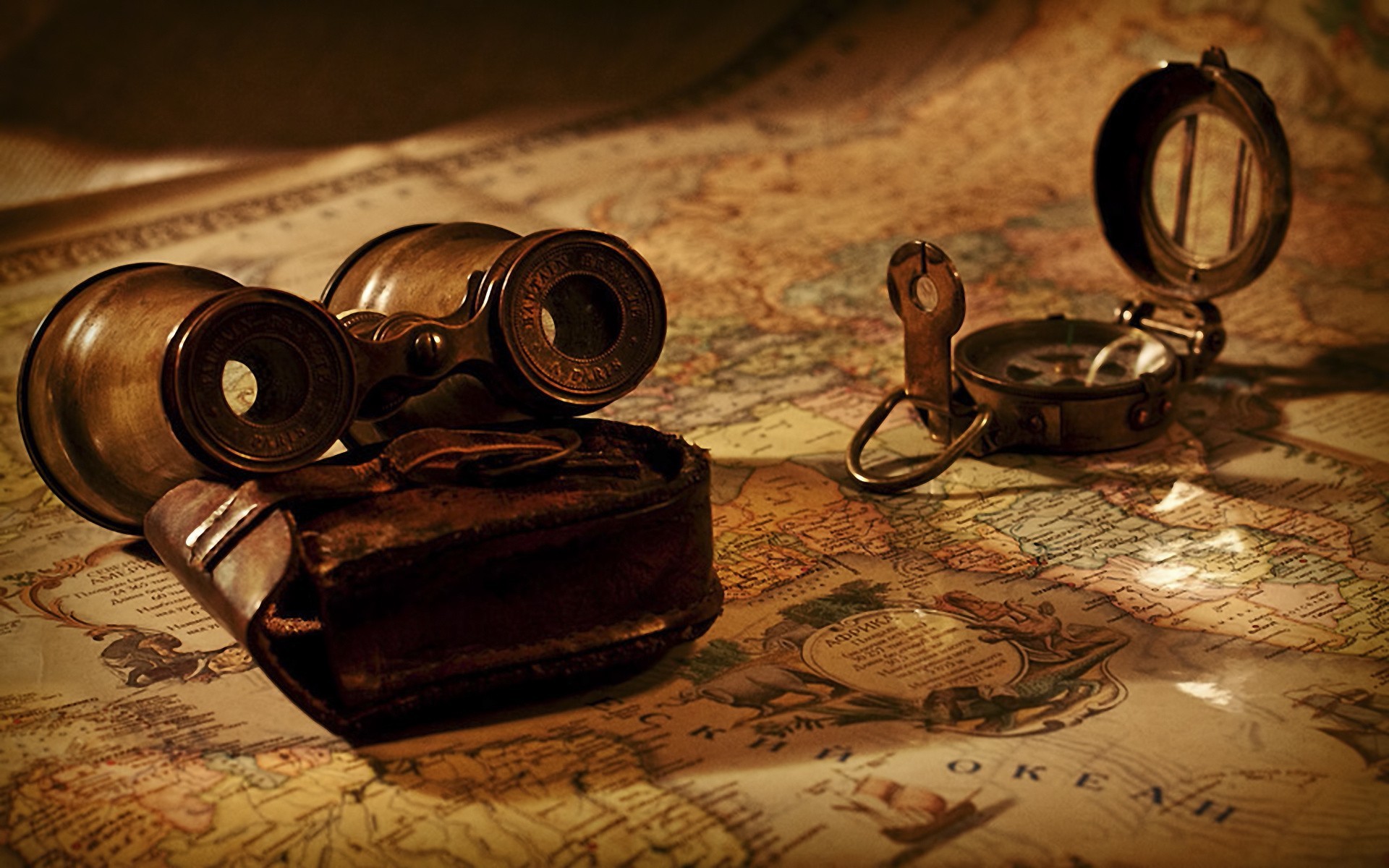 vintage binoculars and compass