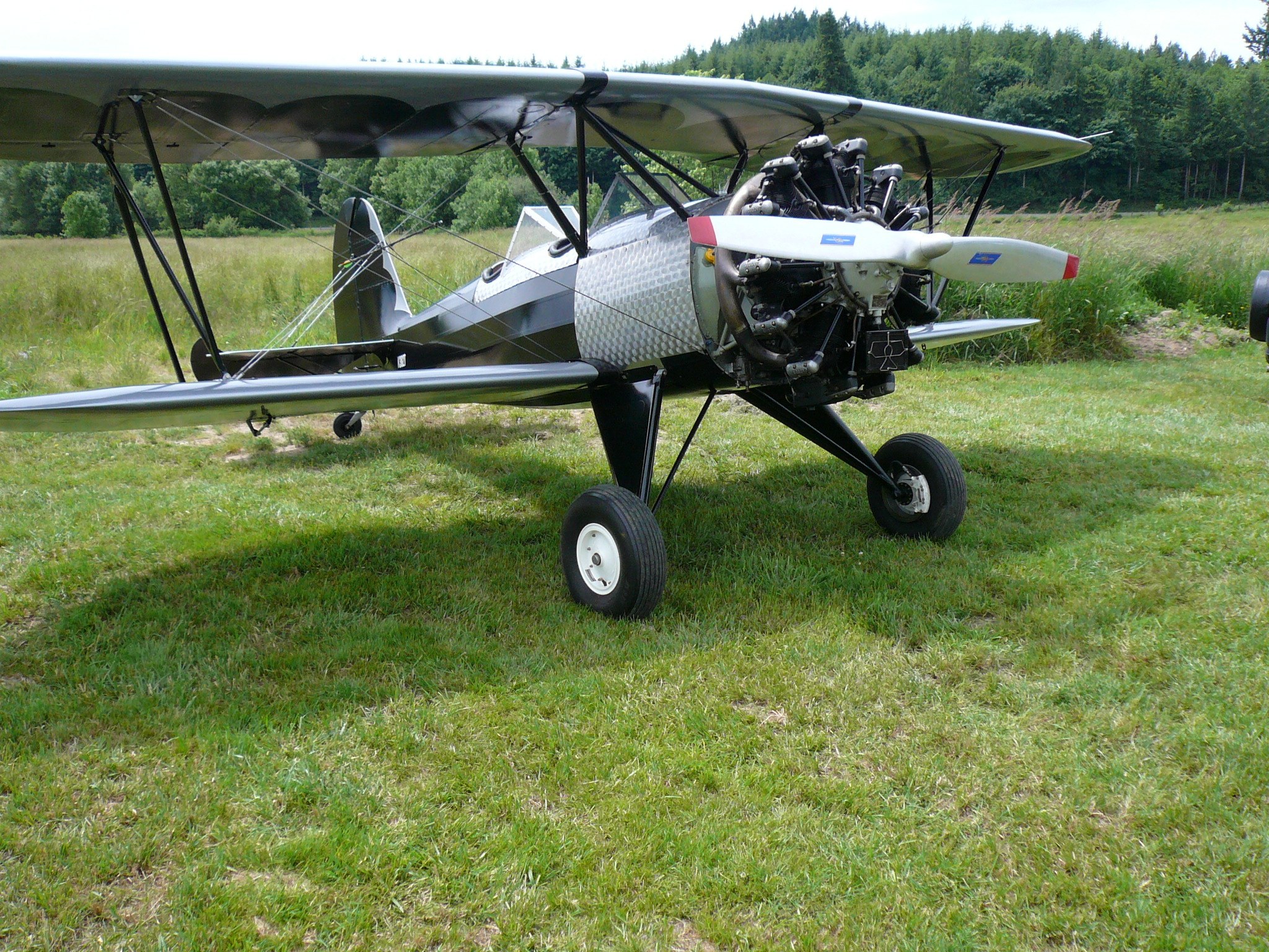 Vintage biplane on grass field
