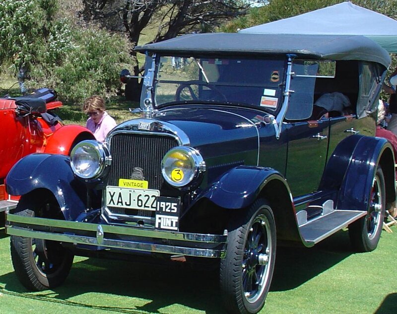 Vintage blue Ford car at show
