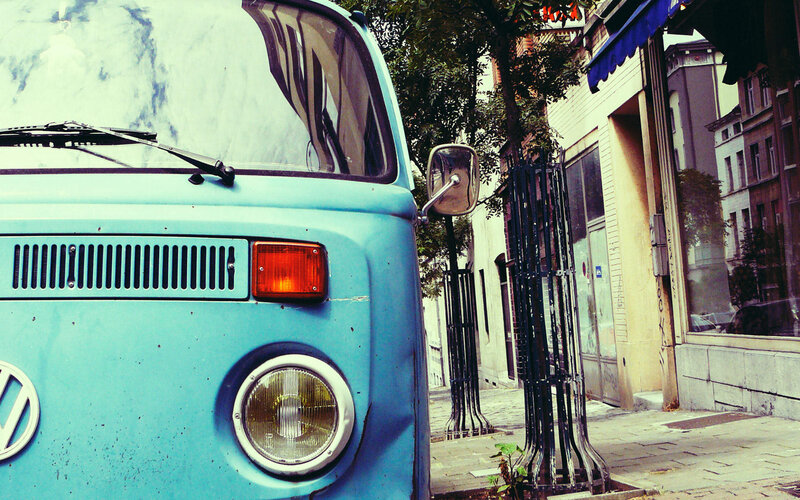 vintage blue van on city street