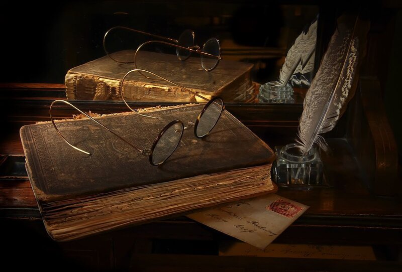 Vintage books and quill pen