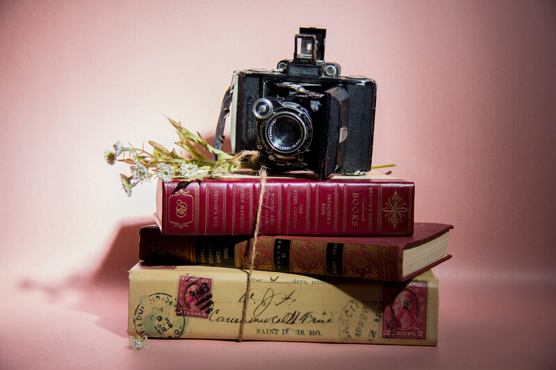 Vintage Camera on Books — Pink