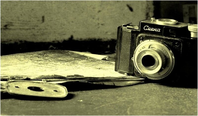 Vintage camera on old papers
