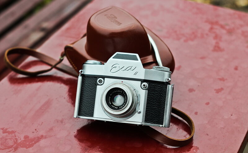 vintage camera on red surface