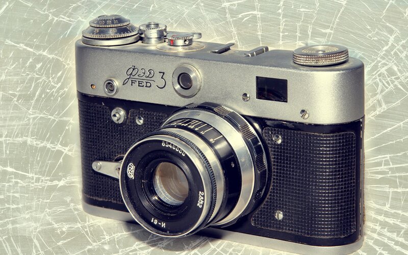 Vintage Camera on Surface — Silver