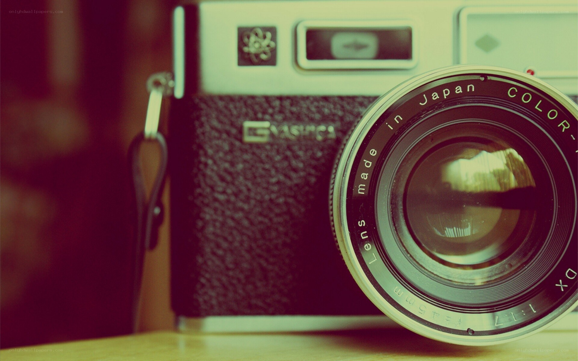 vintage camera on wooden surface