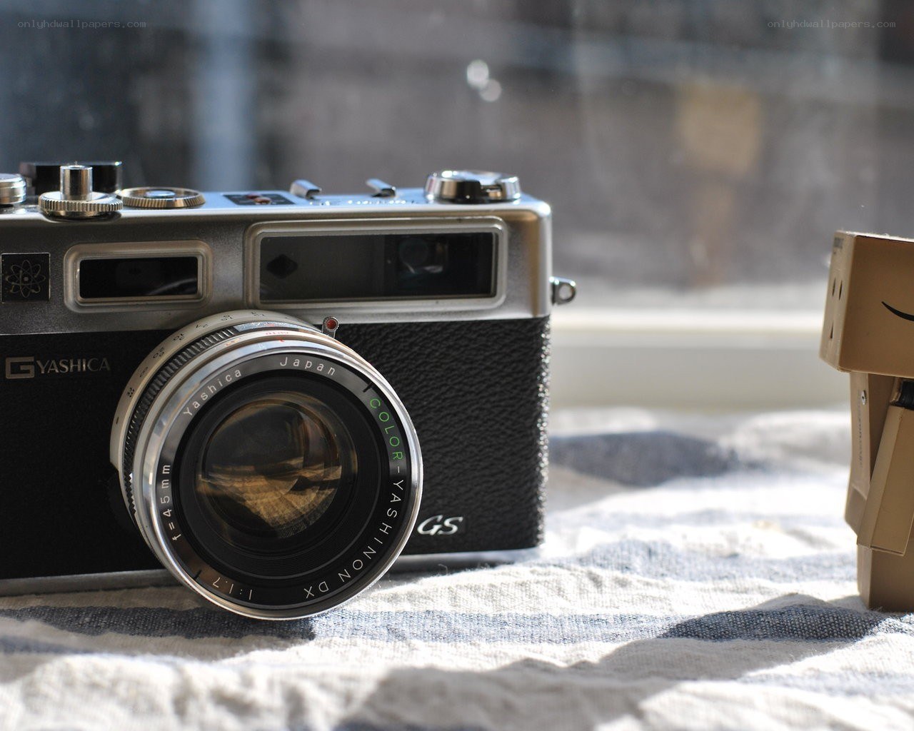 vintage camera with cardboard figure