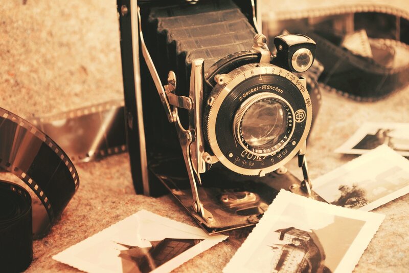 vintage camera with film and photos