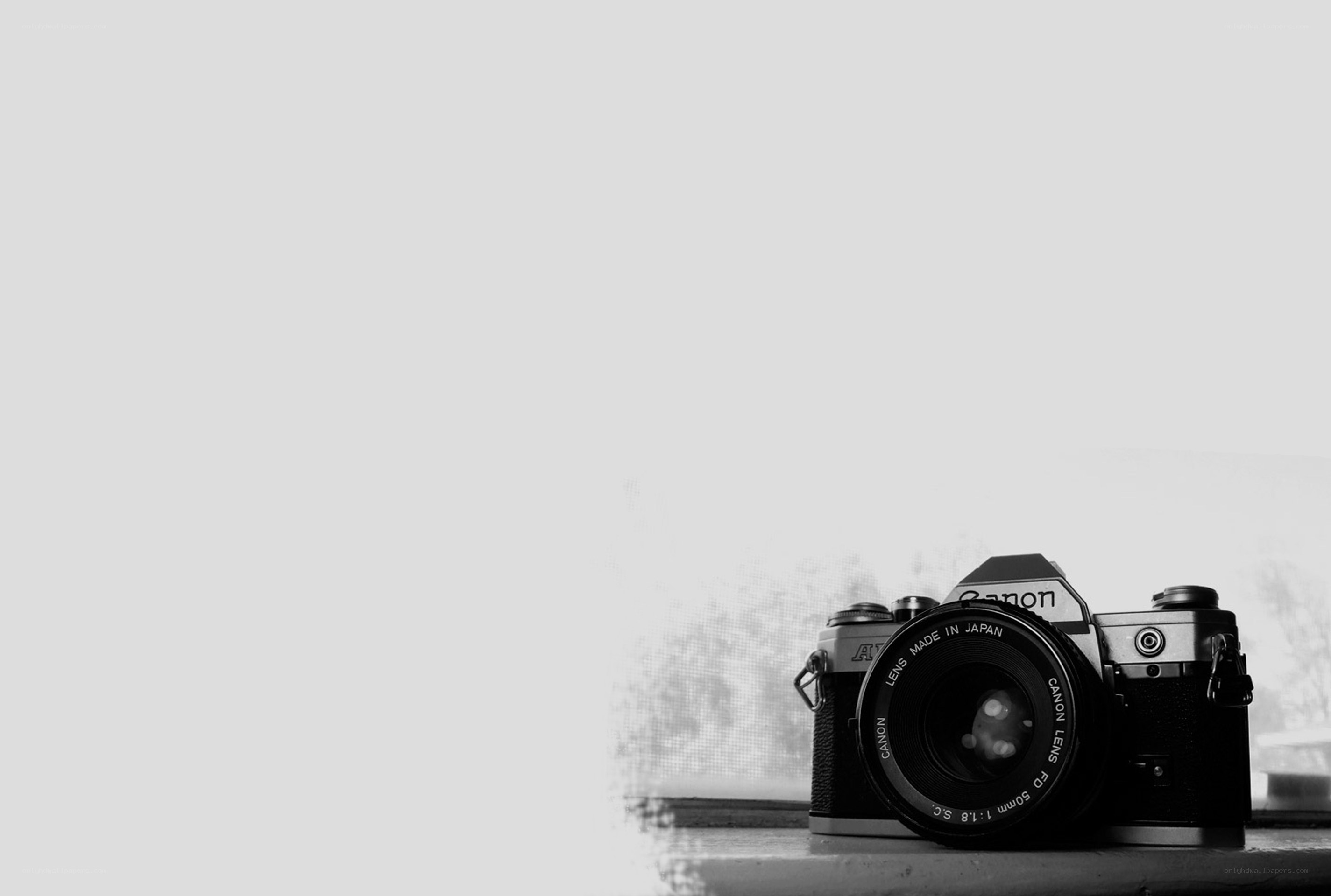 vintage canon camera on windowsill