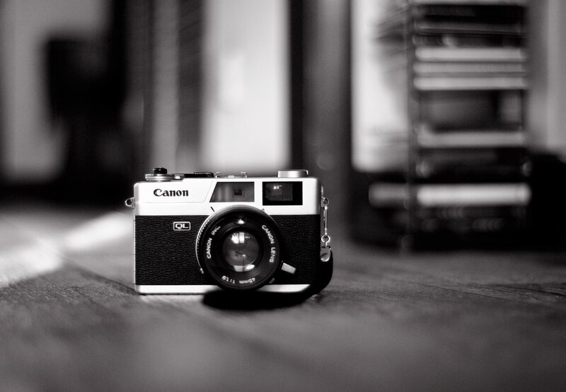 vintage canon camera on wood