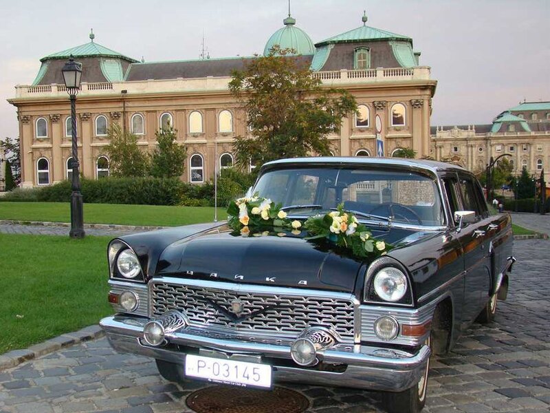 Vintage car at a historic building