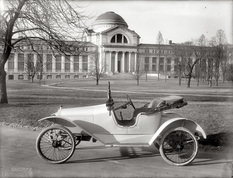 Vintage car in front of a building