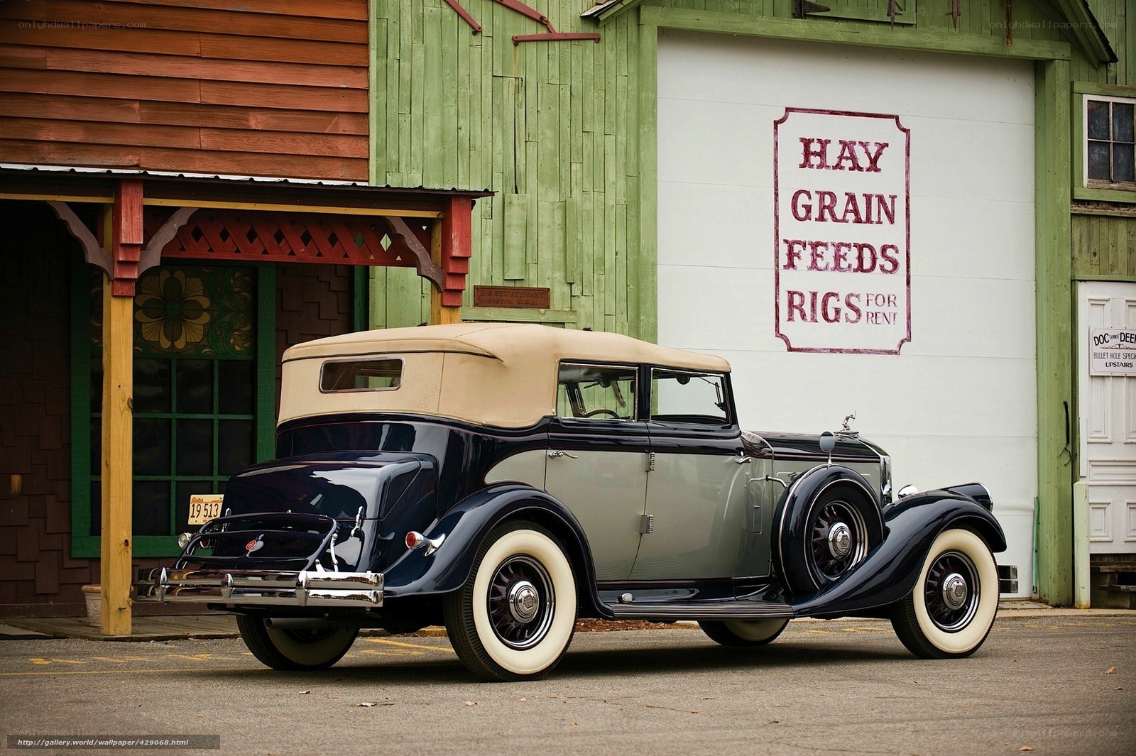 vintage car in front of barn